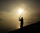 A sports fisherman tries his luck early